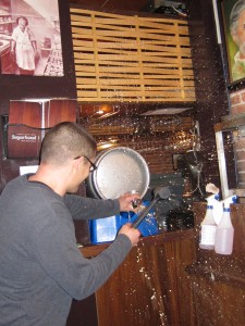 Owen getting wet tapping a cask!
